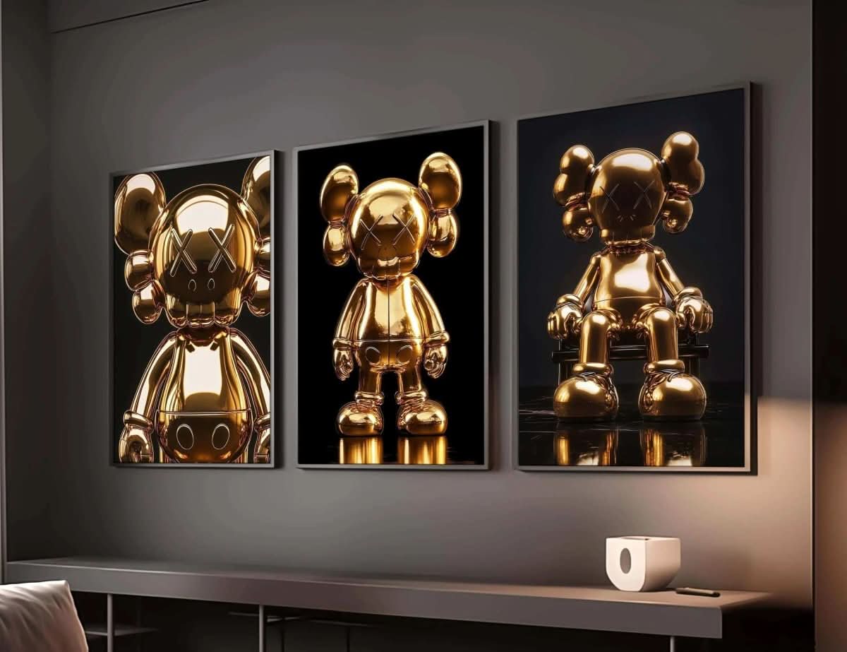 Set of three gold KAWS posters from Hypebeast, showcasing different poses in a modern interior.