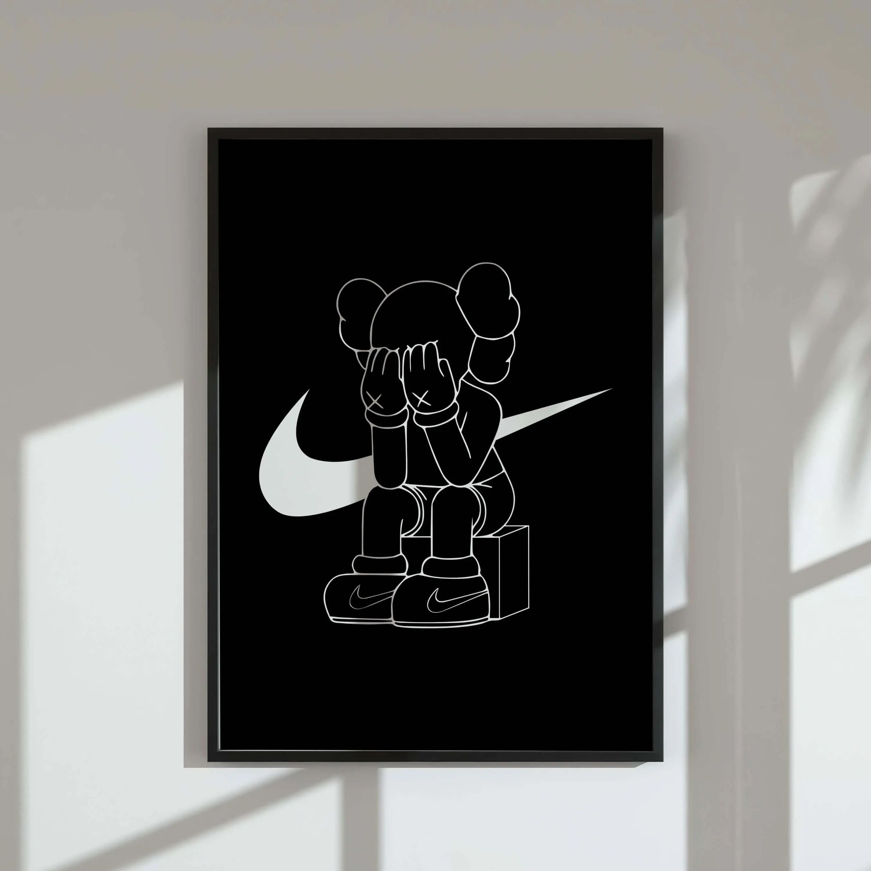 Black and white sneaker art digital wall print featuring a streetwear figure with Nike logo, framed in a modern living room — Luxury HYPEBEAST Wall Art Set of 3, Haus of Prints.