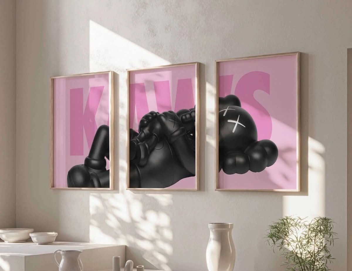 KAWS black figurine on a pink background, with a bold "K" featured prominently in this stylish home decor piece.