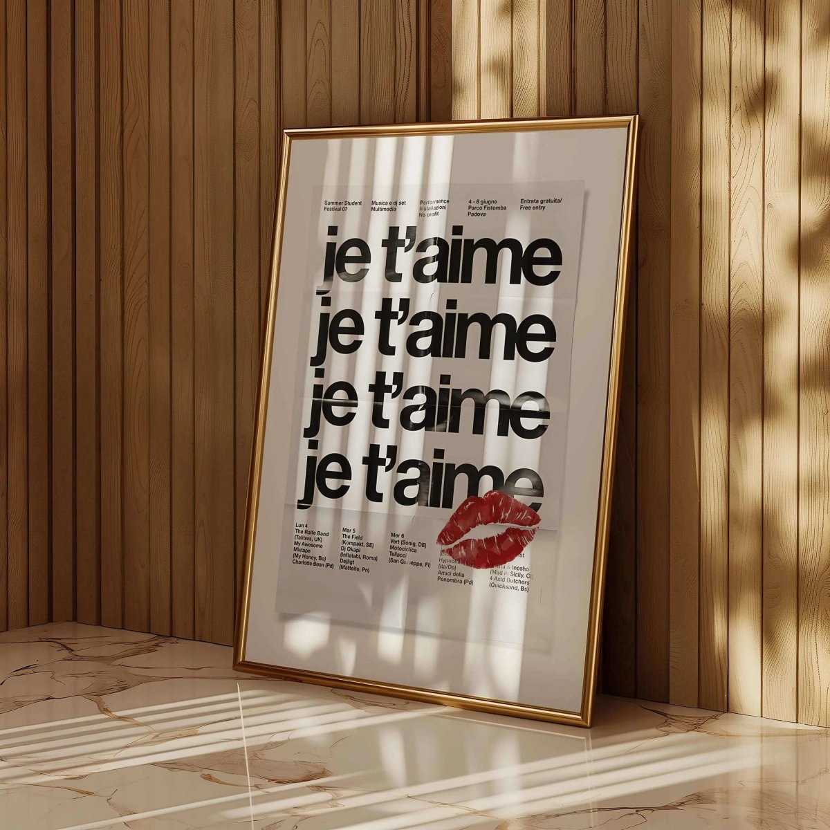 French Quote Poster Room Decor with bold "je t'aime" text and red lipstick print, framed modern wall art for living room by Haus of Prints.