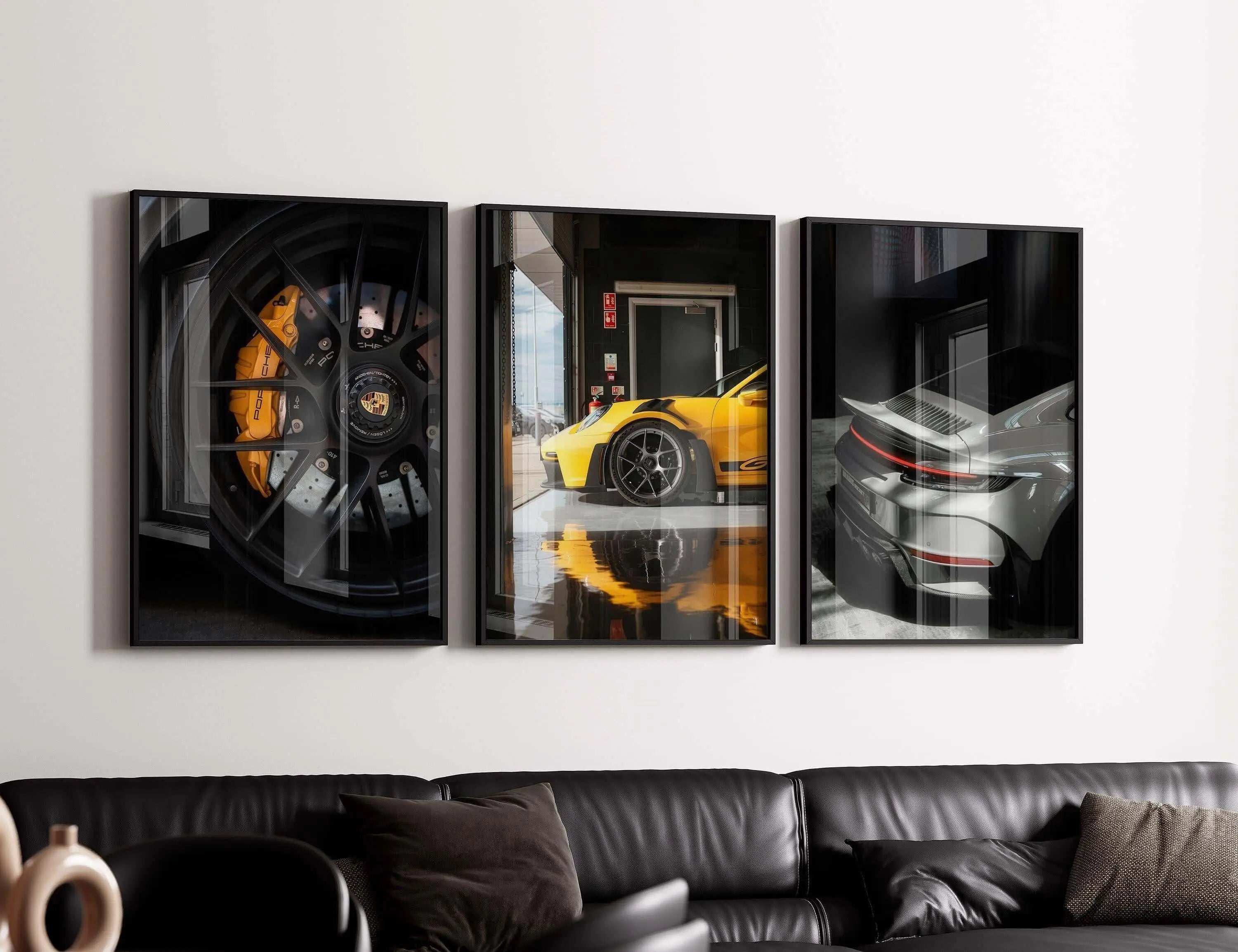 GT3 RS Poster Set of 4 showcasing bold luxury car details in framed digital wall art above a modern black leather sofa — Haus of Prints.