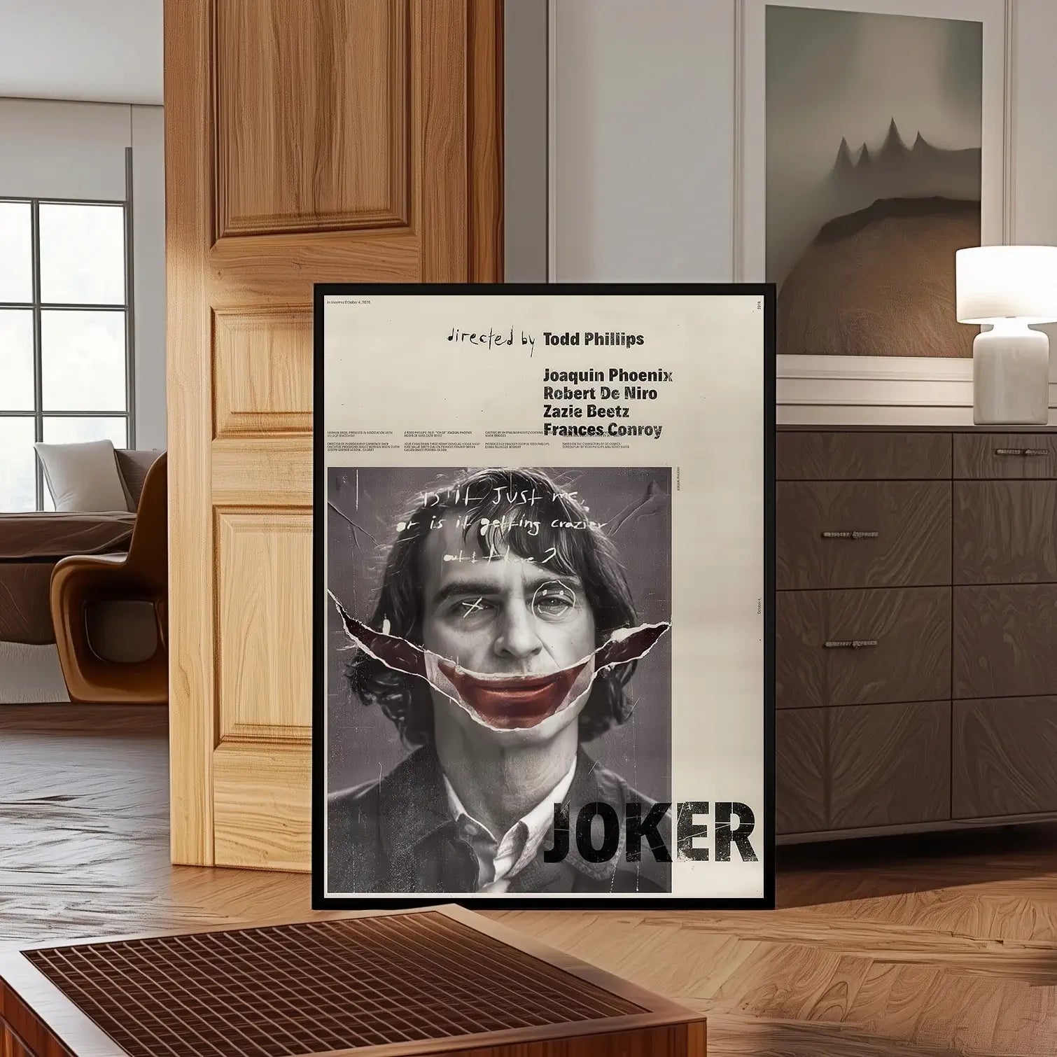 Joker movie poster featuring Joaquin Phoenix with distressed makeup and a red smile in vintage grunge style digital print.