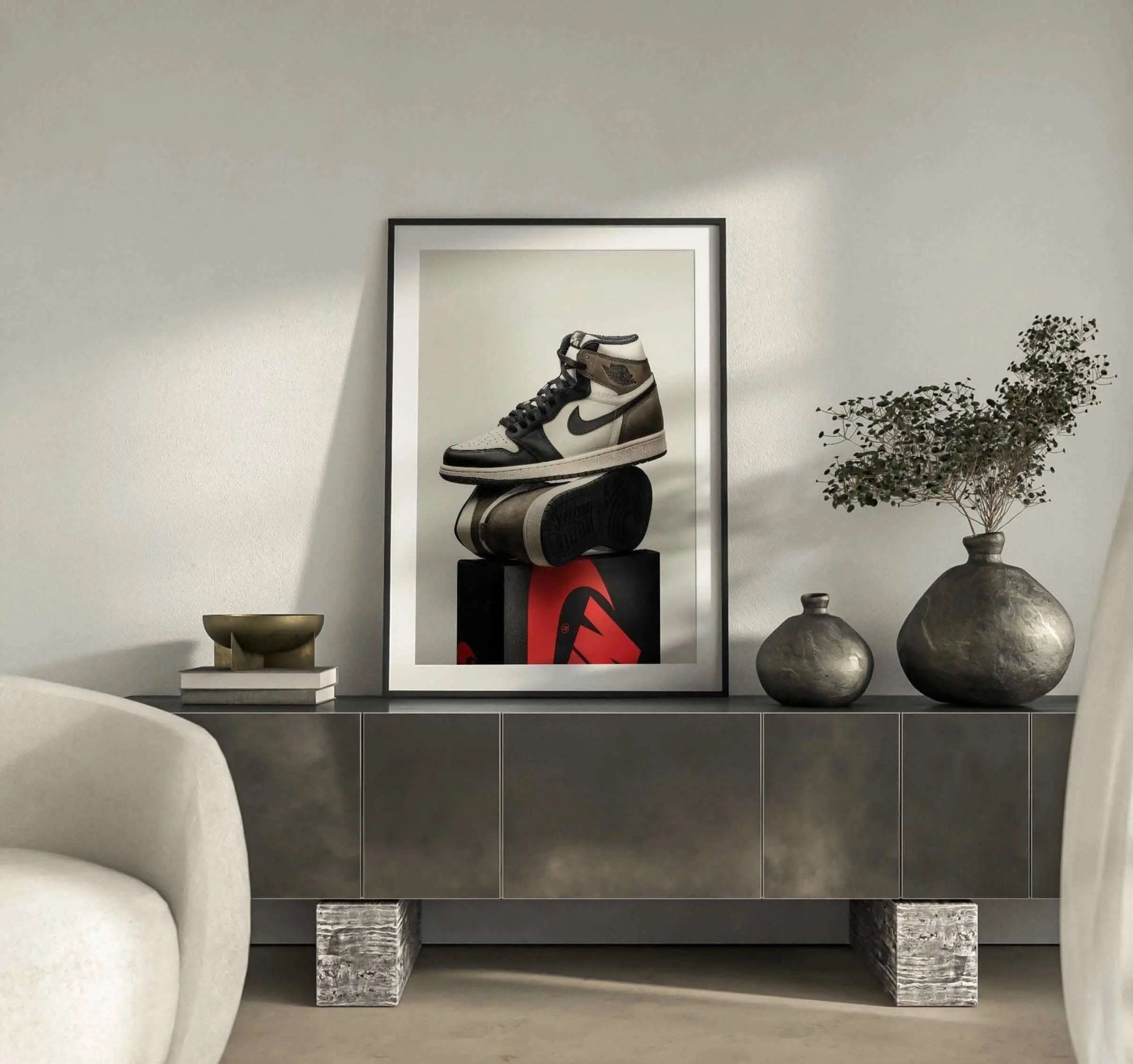 High-resolution wall art of luxury sneakers showcased on a vibrant red and black box.