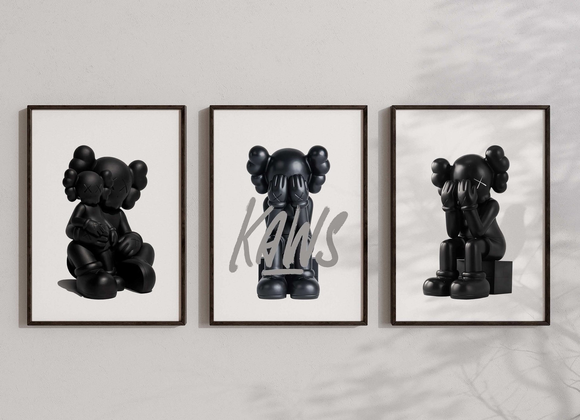 Close-up of Minimal Hypebeast Prints Set of 3 with distinct KAWS black figures, perfect for contemporary wall decor.