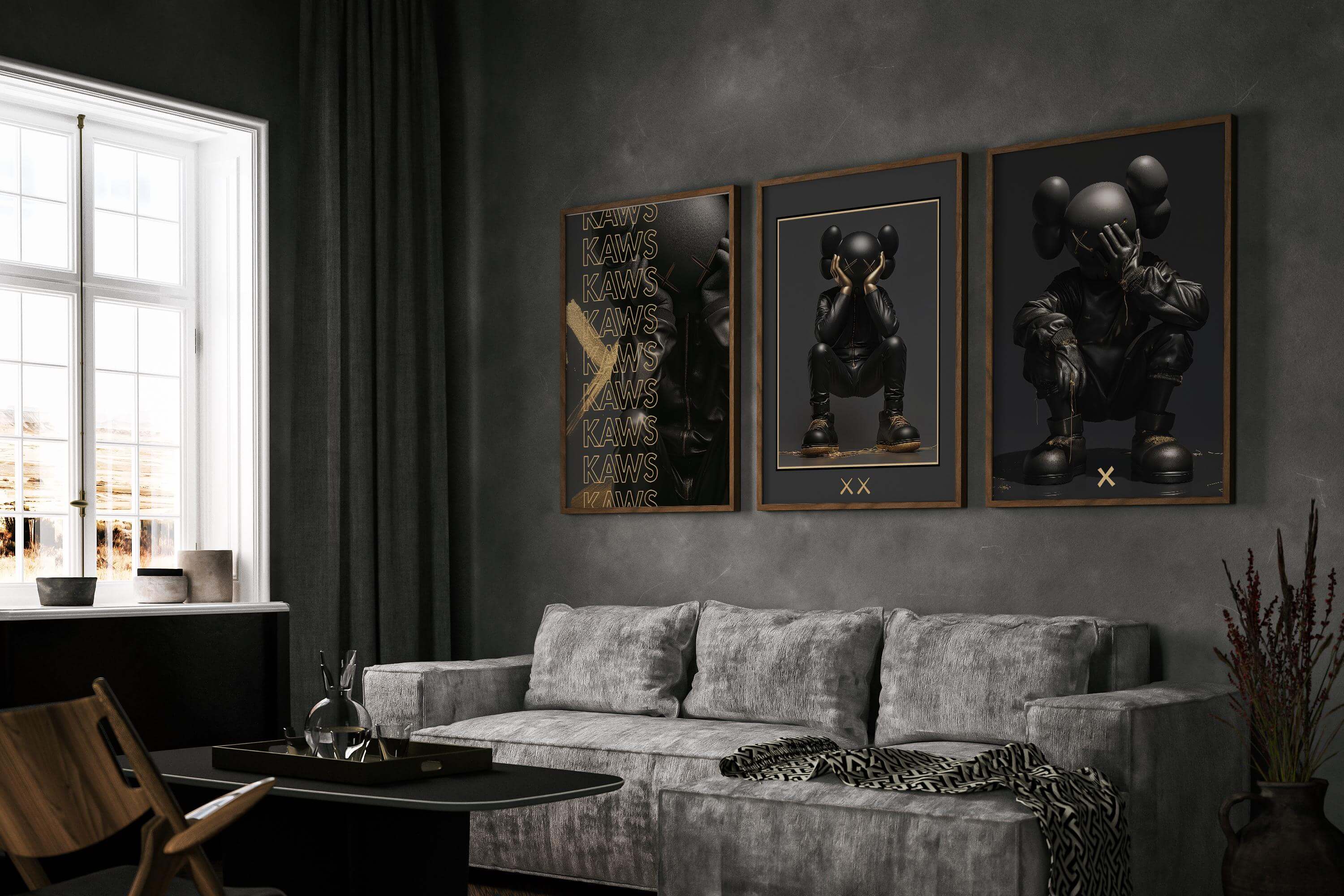 Modern living room featuring three black and gold abstract posters and a stylish gray sofa.