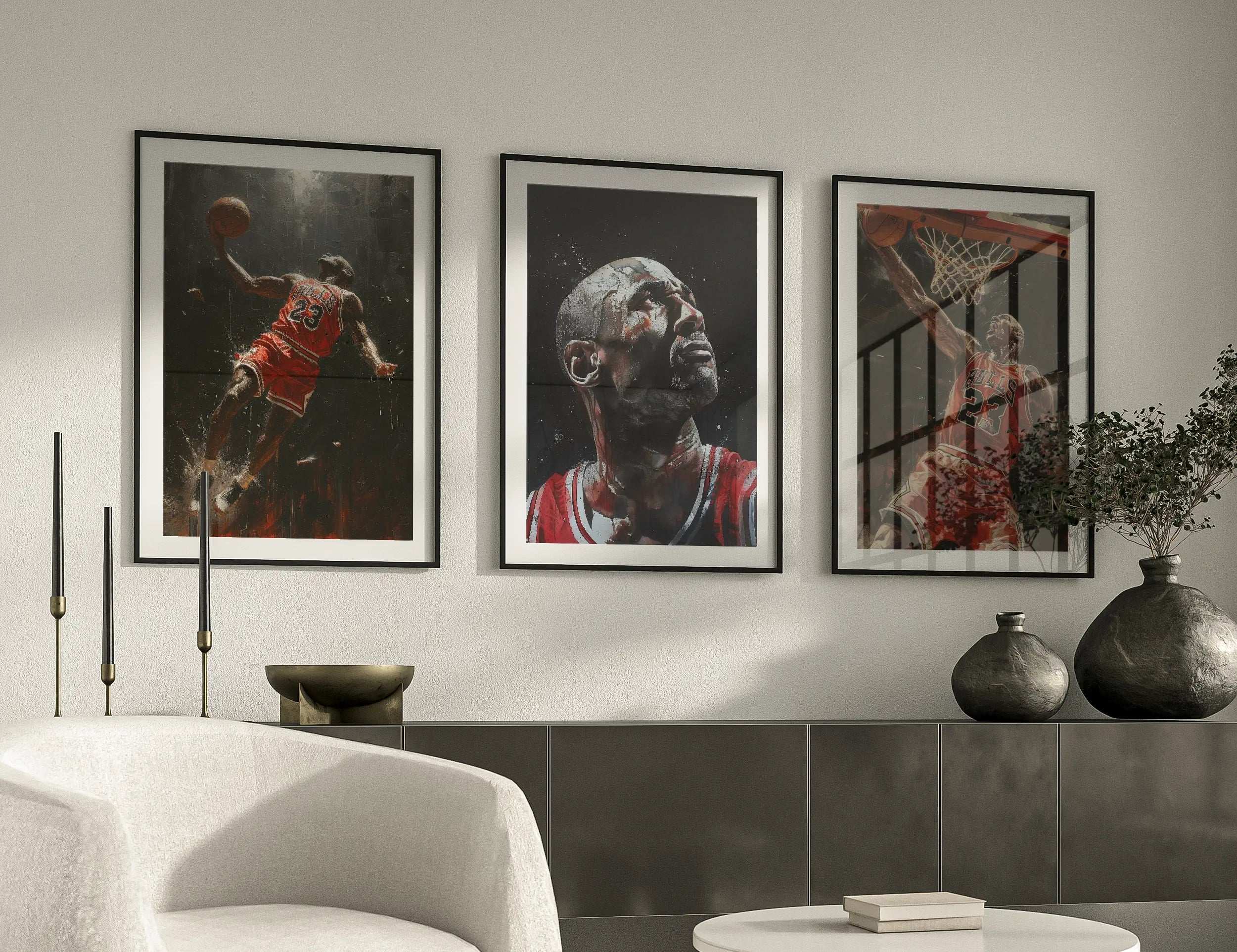 Three framed pictures of a basketball player on a wall above a coffee table.