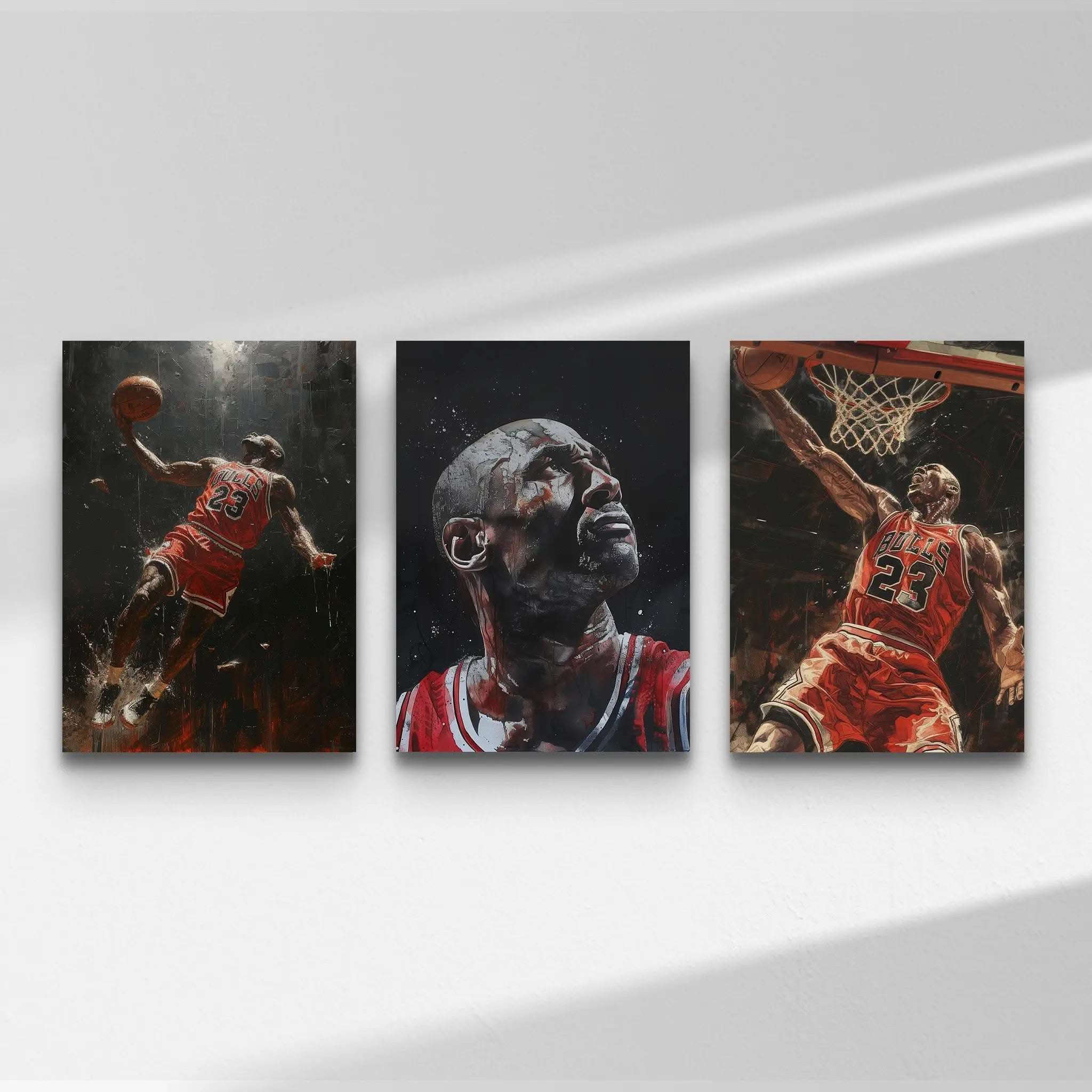 Three basketball-themed paintings on a white wall